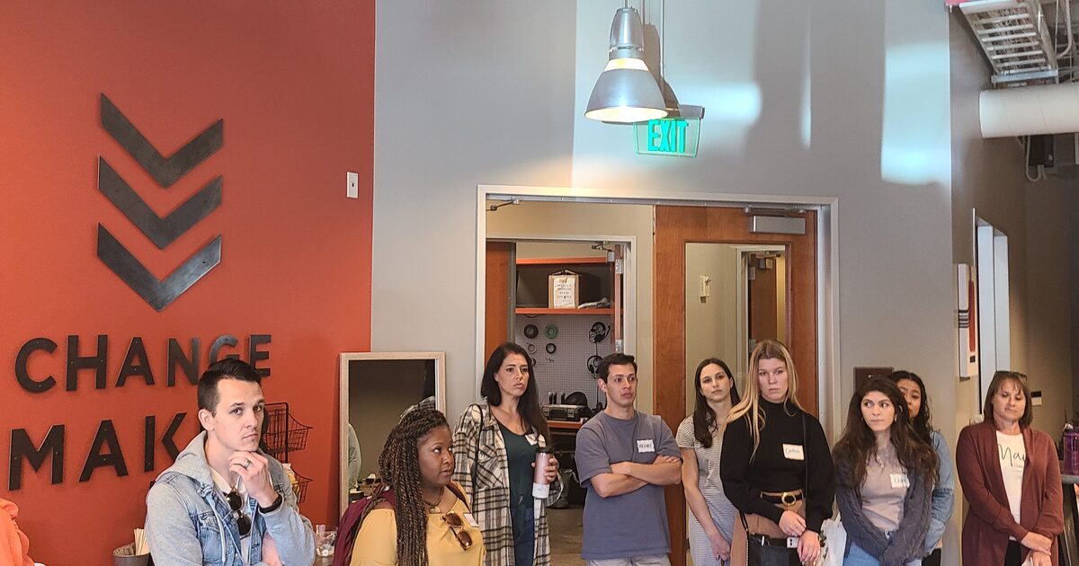 Church volunteers and leaders gathered together in a ministry space